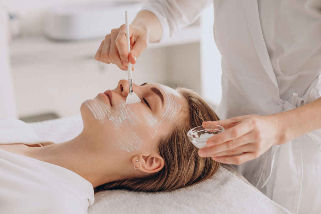 cosmetologist-doing-face-treatment-applying-face-mask (1).jpg